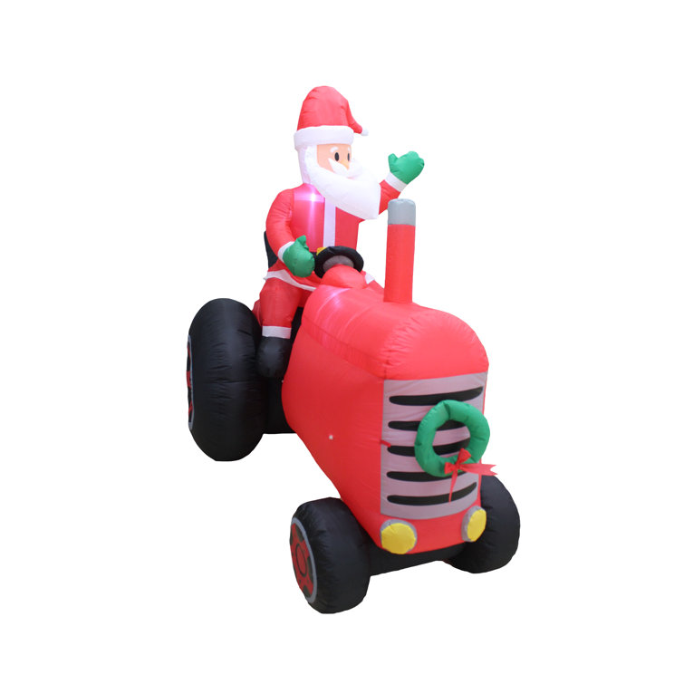 The Holiday Aisle® Santa on Tractor Inflatable Wayfair